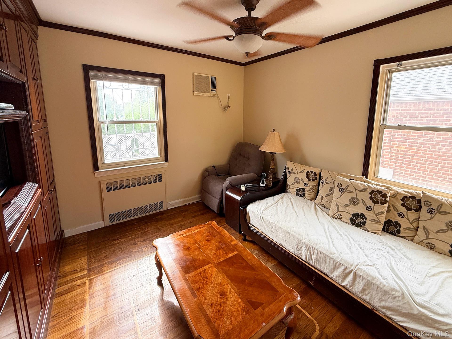 48-22 195th Street Queens, NY 11365 - Photo 8 of 23 a bedroom with bed and window
