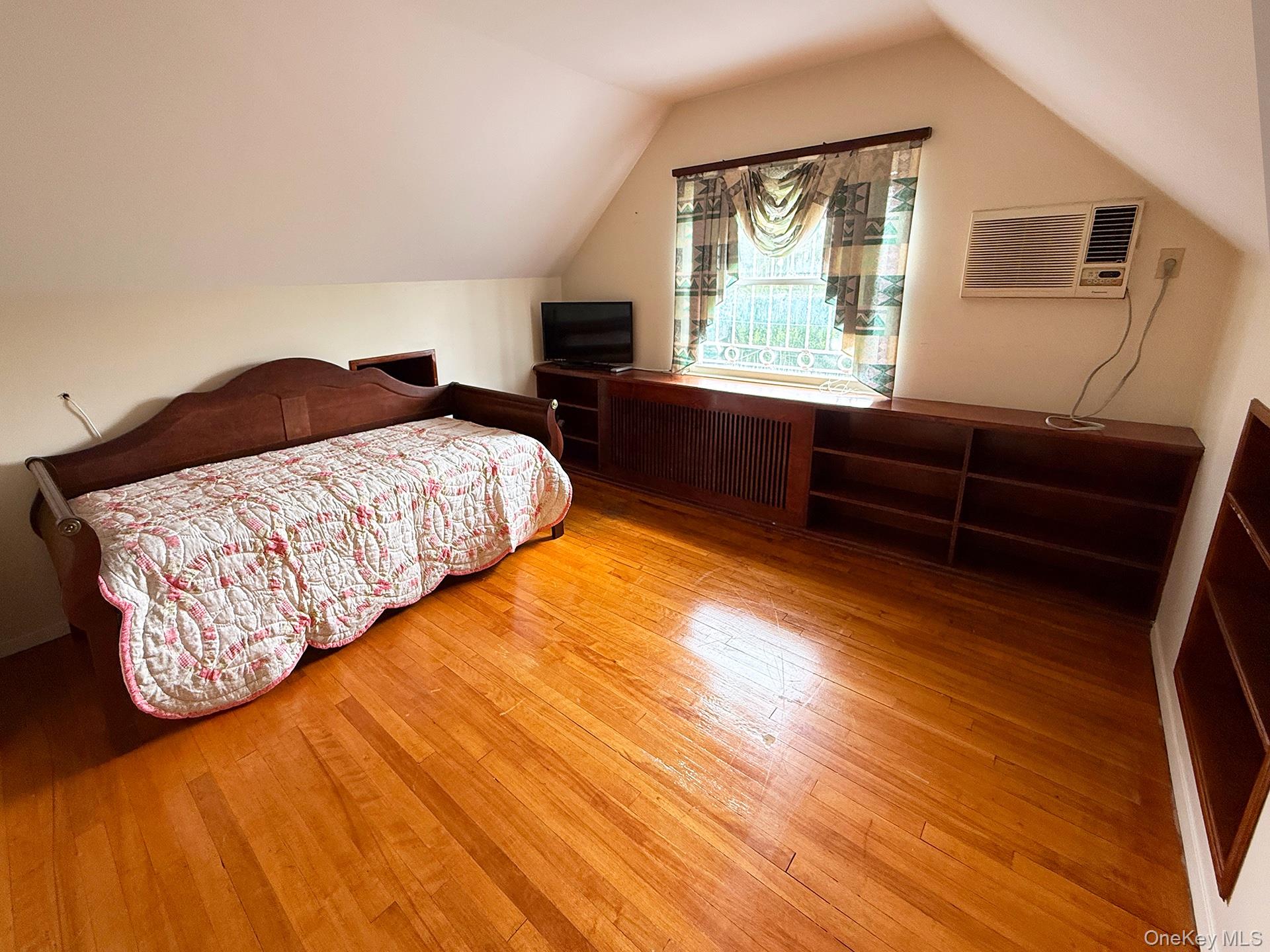 48-22 195th Street Queens, NY 11365 - Photo 10 of 23 a bedroom with a bed and a window