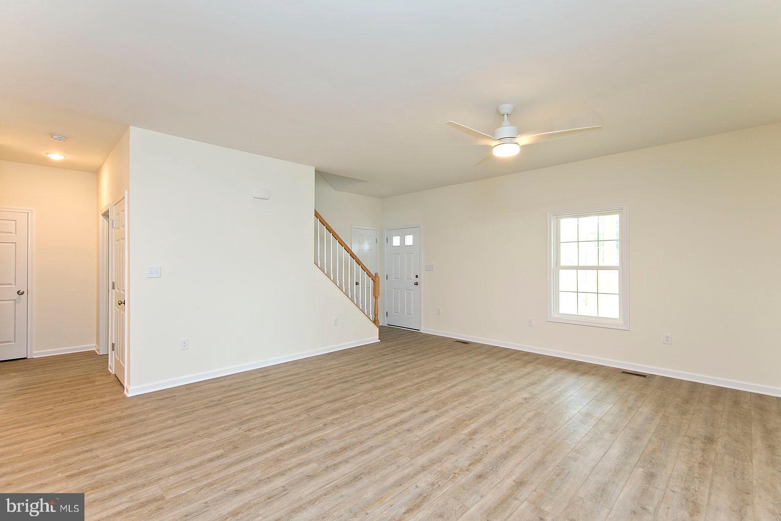 320 Pine Grove Road Bluemont, VA 20135 - Photo 15 of 28 an empty room with wooden floor and windows