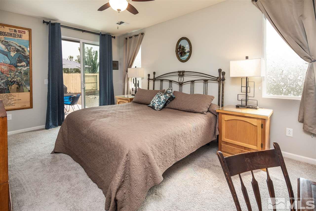 9850 Shadowless Trail Reno, NV 89521 - Photo 23 of 39 a bedroom with a bed and window