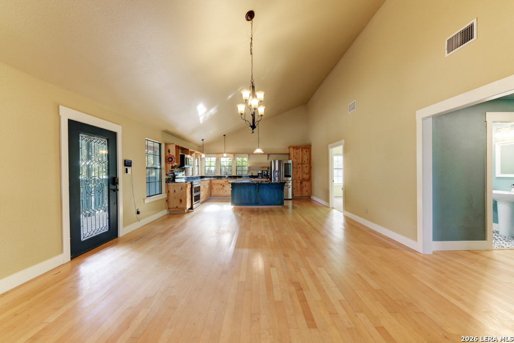 451 Wegener Trail Fischer, TX 78623 - Photo 10 of 43 a view of a house livingroom and chandelier
