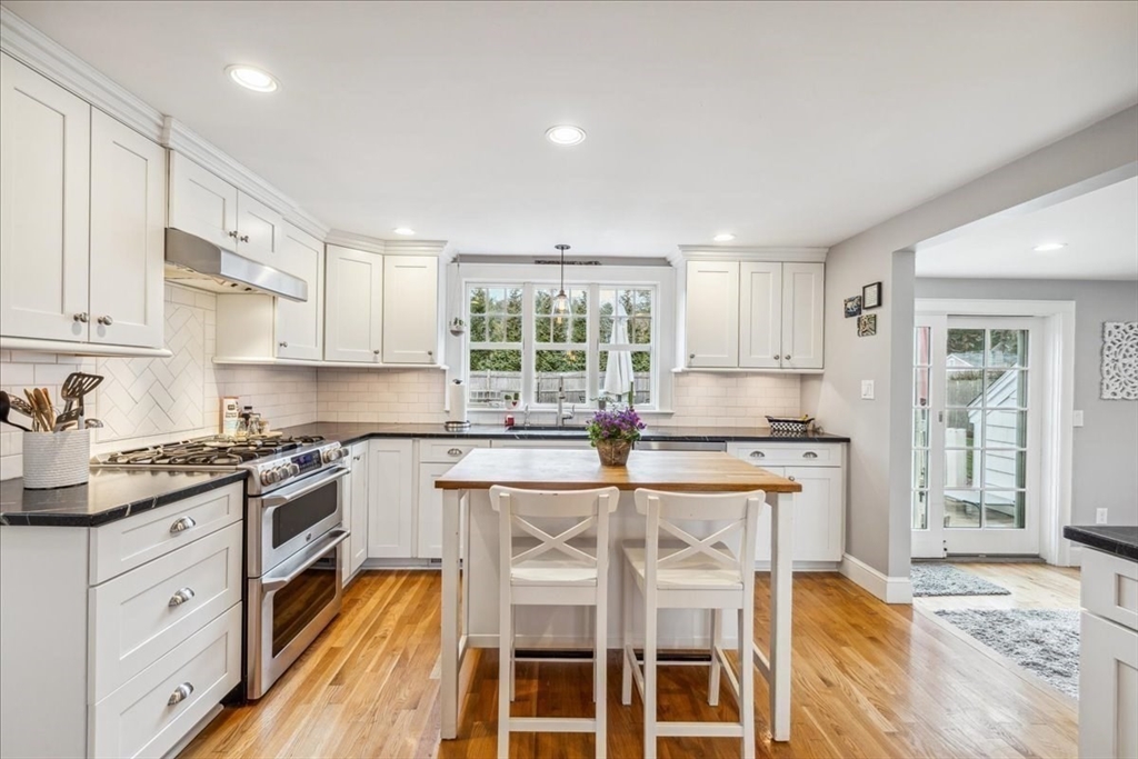 15 Hoover Road Hingham, MA 02043 - Photo 15 of 42 a kitchen with granite countertop white cabinets and white appliances