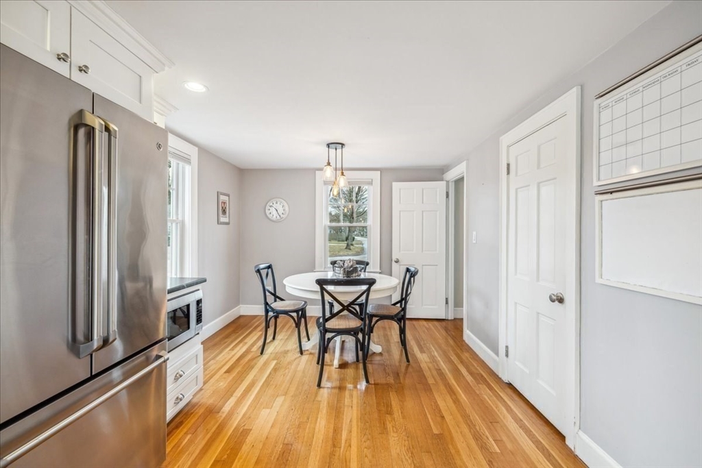 15 Hoover Road Hingham, MA 02043 - Photo 17 of 42 a view of a dining room with furniture window and wooden floor