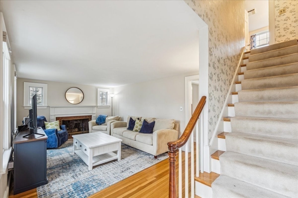 15 Hoover Road Hingham, MA 02043 - Photo 22 of 42 a living room with furniture fireplace a rug and a fireplace