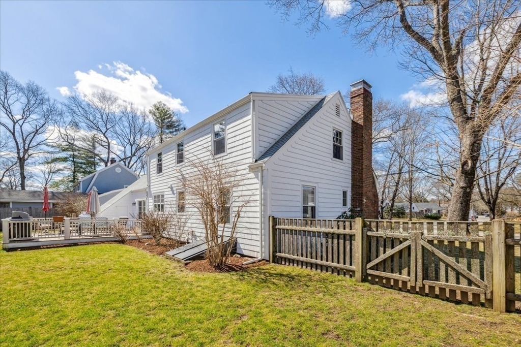 15 Hoover Road Hingham, MA 02043 - Photo 34 of 42 a view of a house with a wooden fence