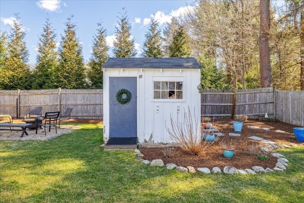 15 Hoover Road Hingham, MA 02043 - Photo 39 of 42 a view of a backyard with a barn and a large tree