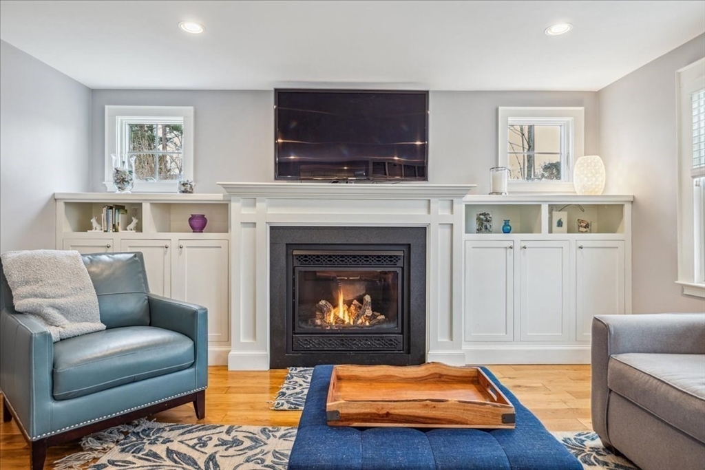 15 Hoover Road Hingham, MA 02043 - Photo 7 of 42 a living room with furniture and a fireplace