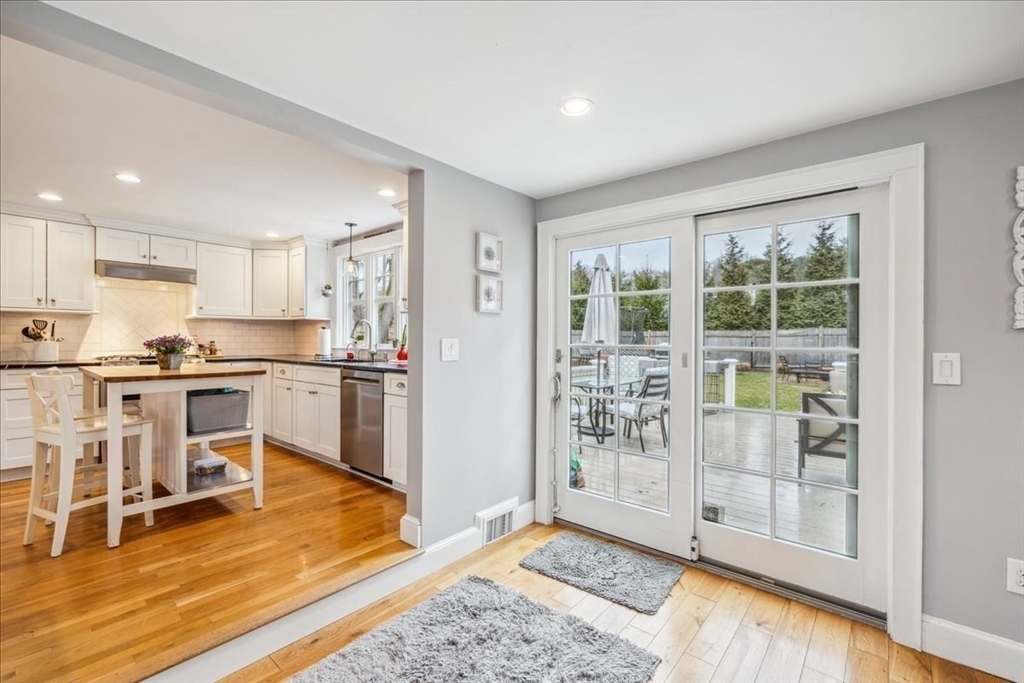 15 Hoover Road Hingham, MA 02043 - Photo 10 of 42 a kitchen with granite countertop a stove and a refrigerator