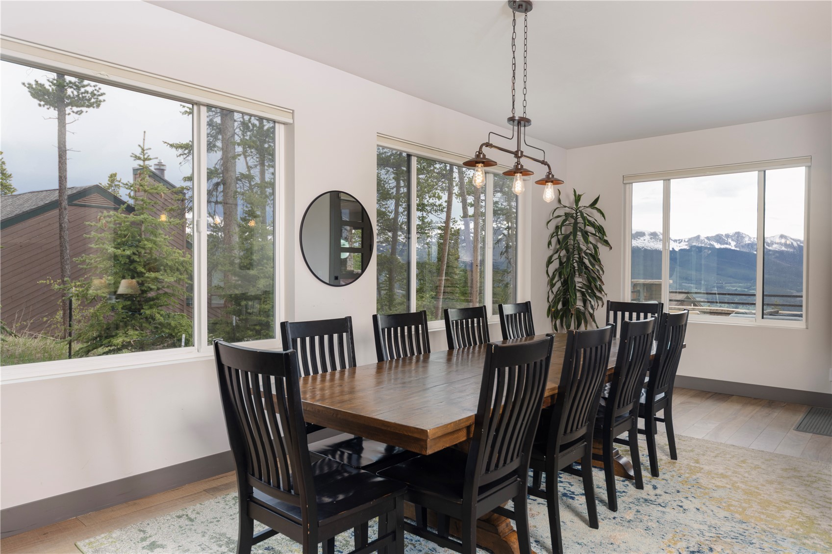 260 Fuller Placer Road Breckenridge, CO 80424 - Photo 10 of 32 a dining room with furniture a chandelier and wooden floor
