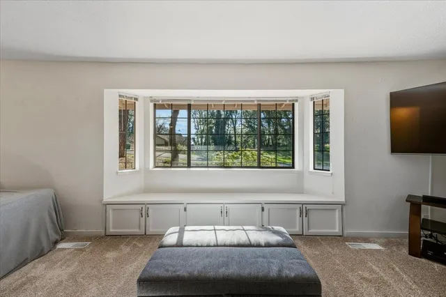 a kitchen with a refrigerator a stove top oven a sink dishwasher and white cabinets with wooden floor