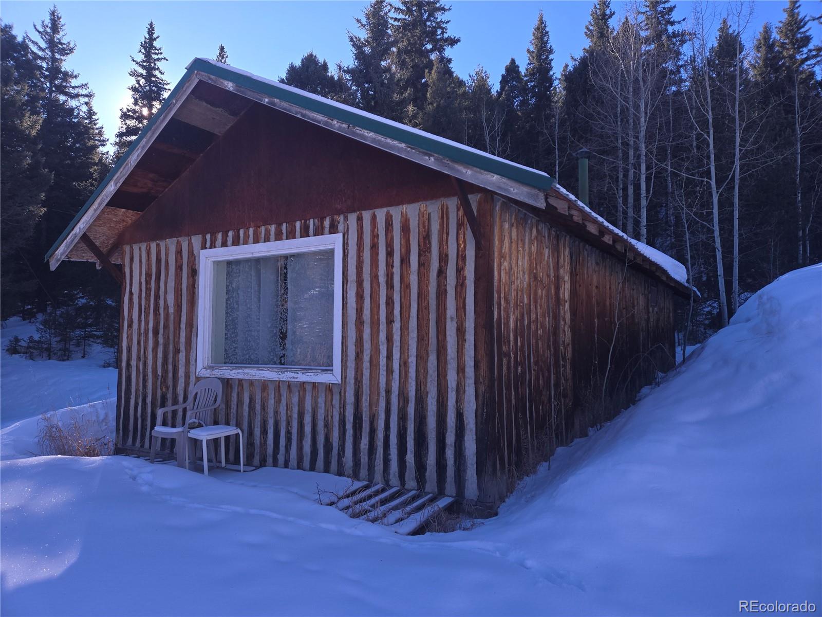 Foxton Road Conifer, CO 80433 - Photo 16 of 27 a view of a house with backyard and green space