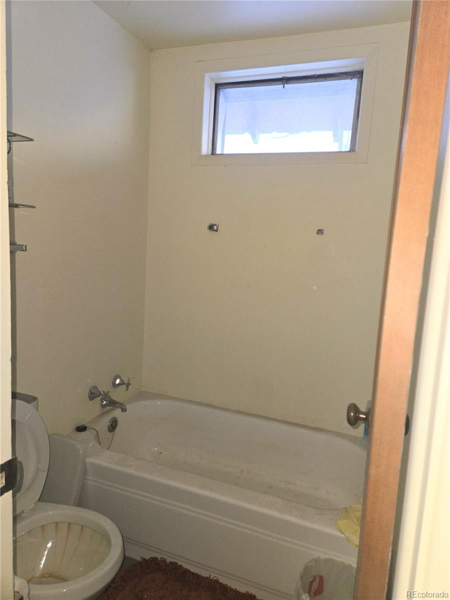 Foxton Road Conifer, CO 80433 - Photo 18 of 27 a bathroom with a sink a toilet and bathtub