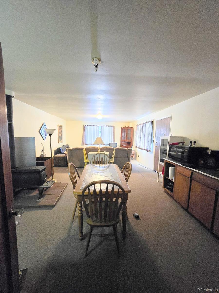 Foxton Road Conifer, CO 80433 - Photo 20 of 27 a living room with furniture and a flat screen tv