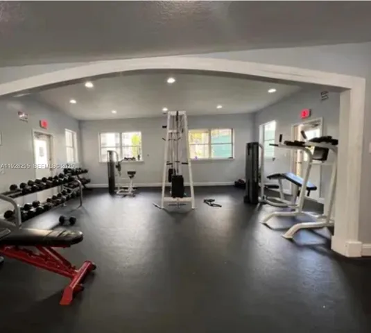 a room with gym equipment and a large window