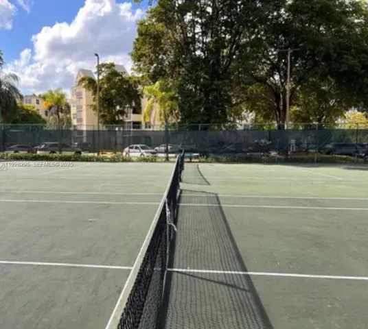 a view of an outdoor space and tennis court