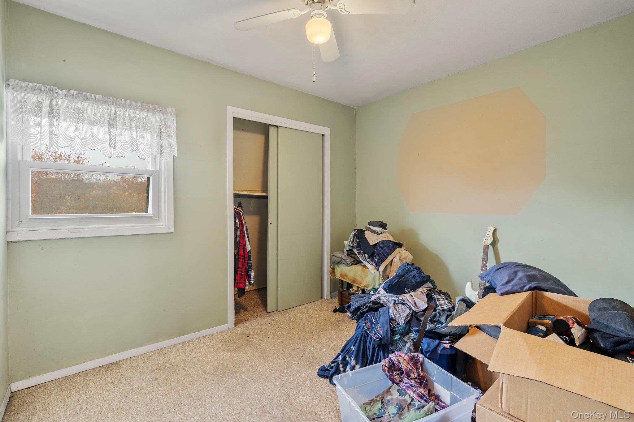 24 Russet Road Poughkeepsie, NY 12601 - Photo 12 of 26 a living room with furniture and a window