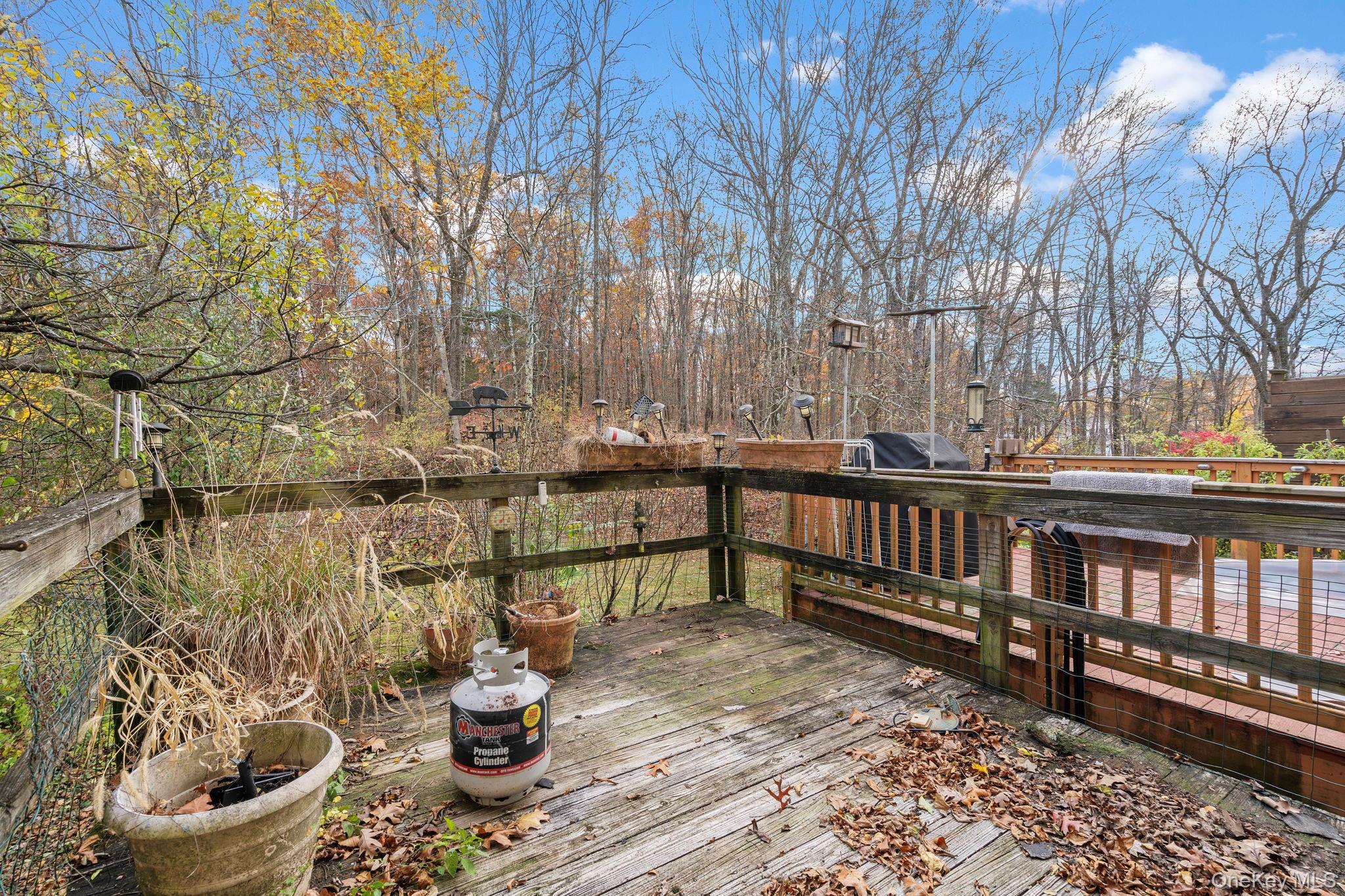 24 Russet Road Poughkeepsie, NY 12601 - Photo 19 of 26 a balcony with wooden floor and outdoor seating