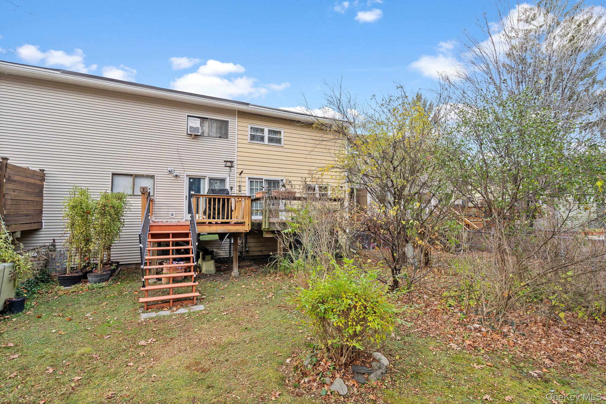 24 Russet Road Poughkeepsie, NY 12601 - Photo 22 of 26 a backyard of a house with barbeque oven table and chairs