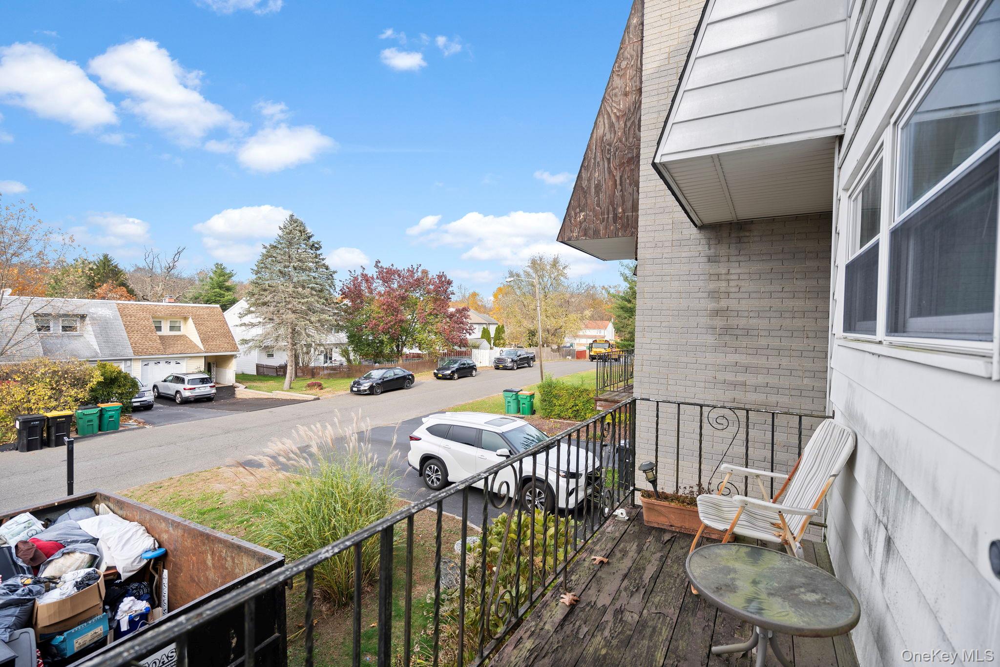 24 Russet Road Poughkeepsie, NY 12601 - Photo 23 of 26 a view of a patio with couches chairs and a potted plant on the wall