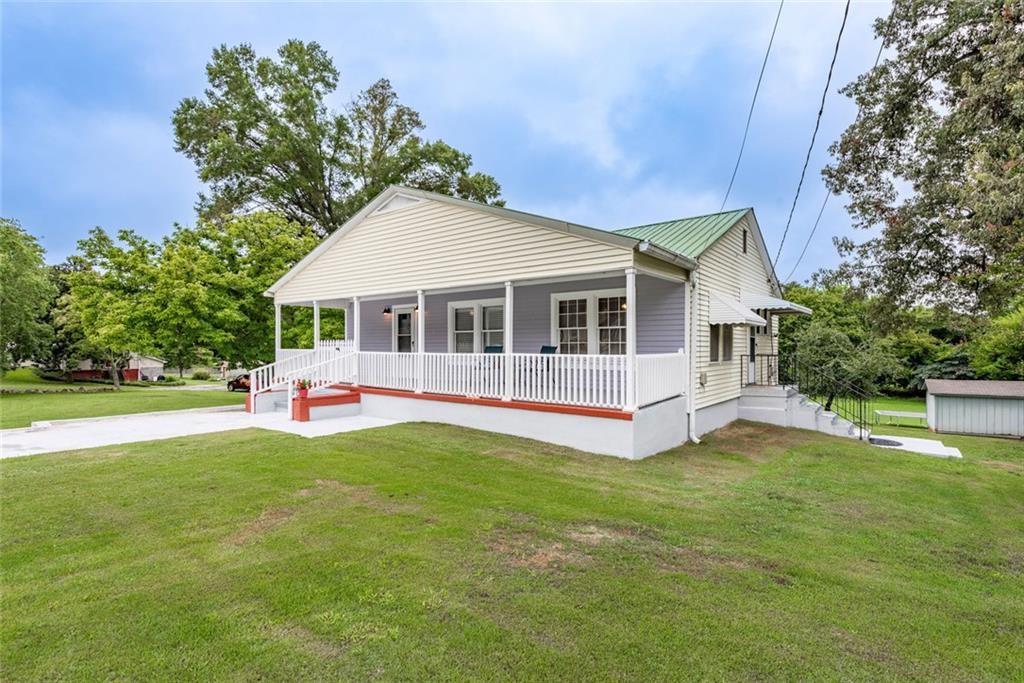2508 Maple Road Southeast Rome, GA 30161 - Photo 1 of 55 a house view with a sitting space and garden