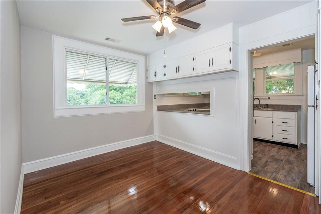 2508 Maple Road Southeast Rome, GA 30161 - Photo 11 of 55 a view of an empty room with window and wooden floor