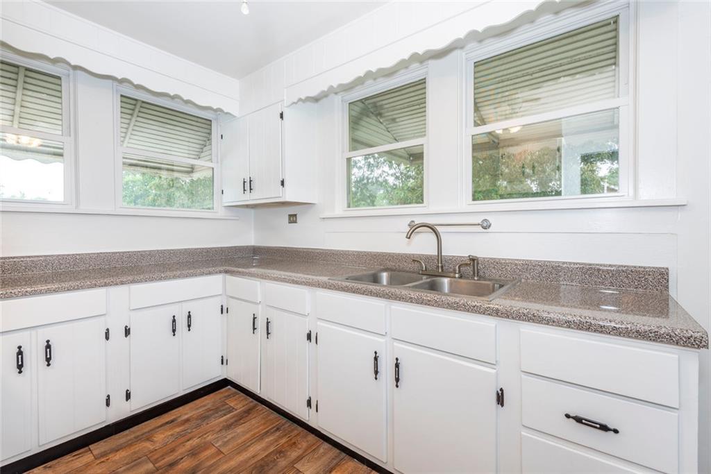 2508 Maple Road Southeast Rome, GA 30161 - Photo 14 of 55 a kitchen with granite countertop white cabinets and a window