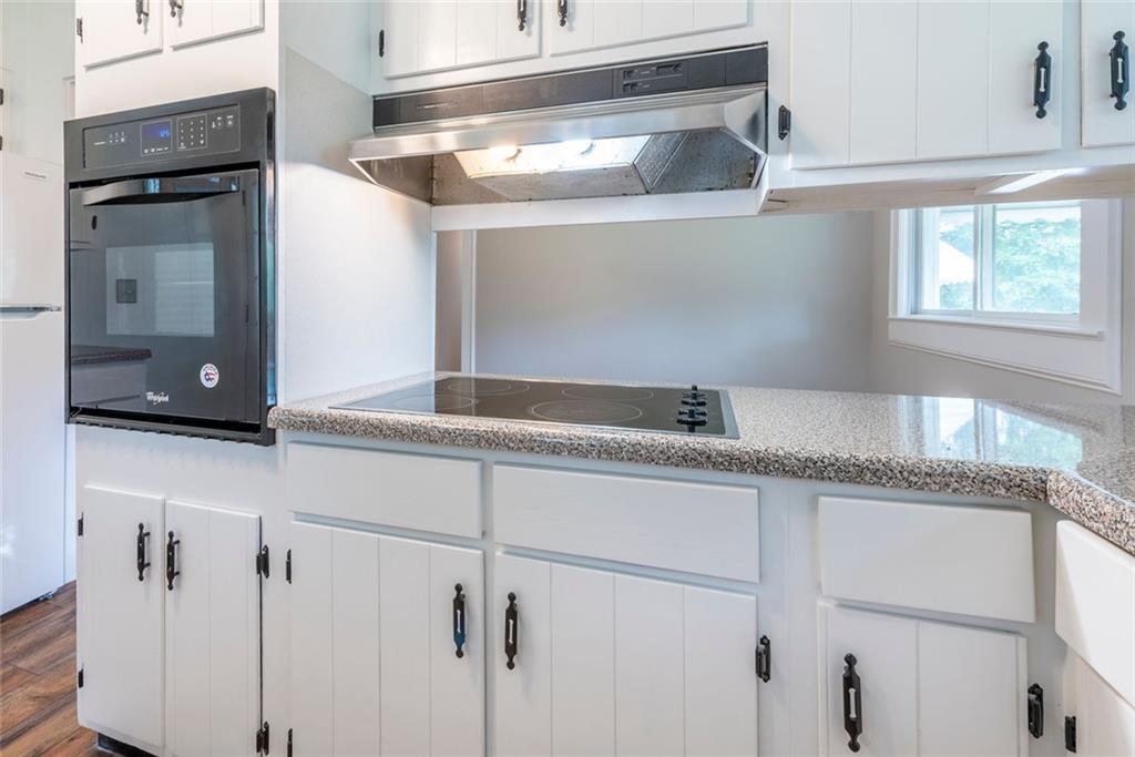 2508 Maple Road Southeast Rome, GA 30161 - Photo 16 of 55 a kitchen with granite countertop a sink and cabinets
