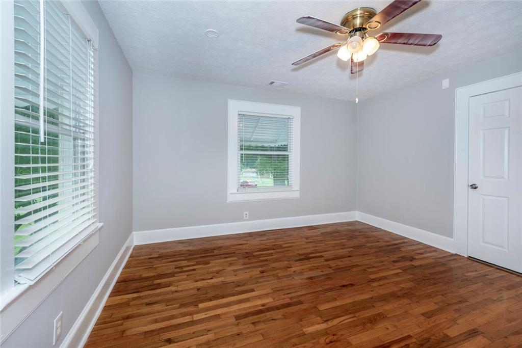 2508 Maple Road Southeast Rome, GA 30161 - Photo 19 of 55 wooden floor in an empty room with a window