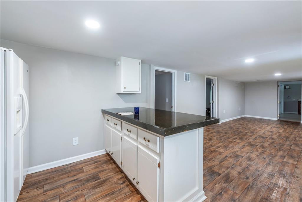 2508 Maple Road Southeast Rome, GA 30161 - Photo 29 of 55 a kitchen with granite countertop a sink and a stove