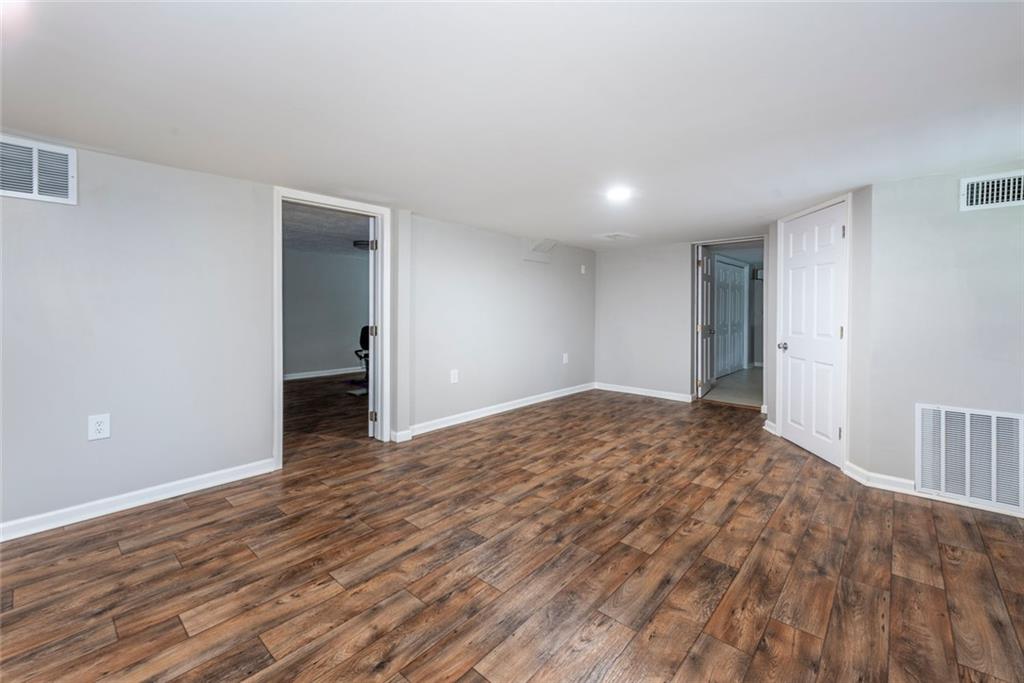 2508 Maple Road Southeast Rome, GA 30161 - Photo 33 of 55 a view of empty room with wooden floor