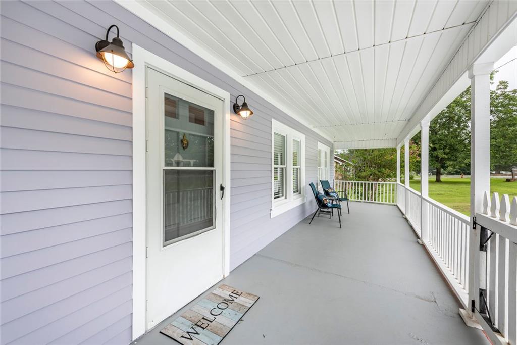 2508 Maple Road Southeast Rome, GA 30161 - Photo 5 of 55 a view of a porch with chairs and backyard