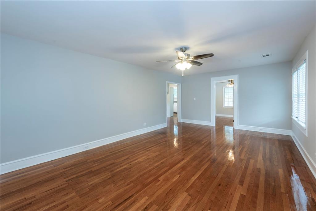2508 Maple Road Southeast Rome, GA 30161 - Photo 8 of 55 a view of an empty room with window and wooden floor
