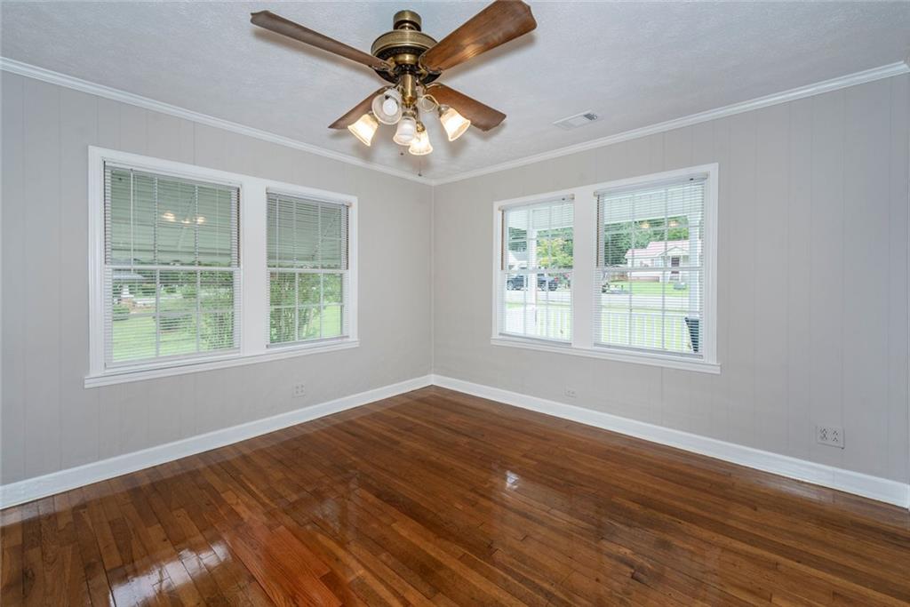 2508 Maple Road Southeast Rome, GA 30161 - Photo 9 of 55 a view of an empty room with wooden floor and a window