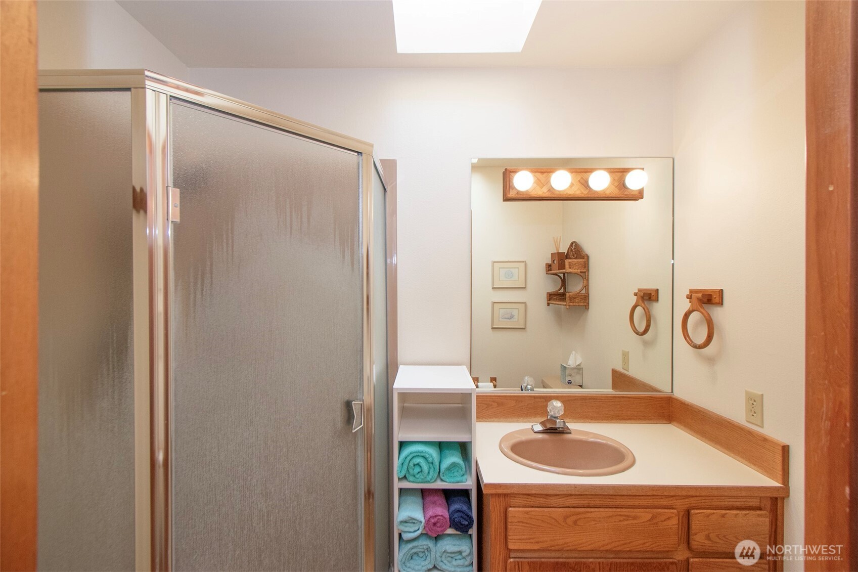5418 South Old Mill Road Port Angeles, WA 98362 - Photo 16 of 39 a bathroom with a sink and a mirror