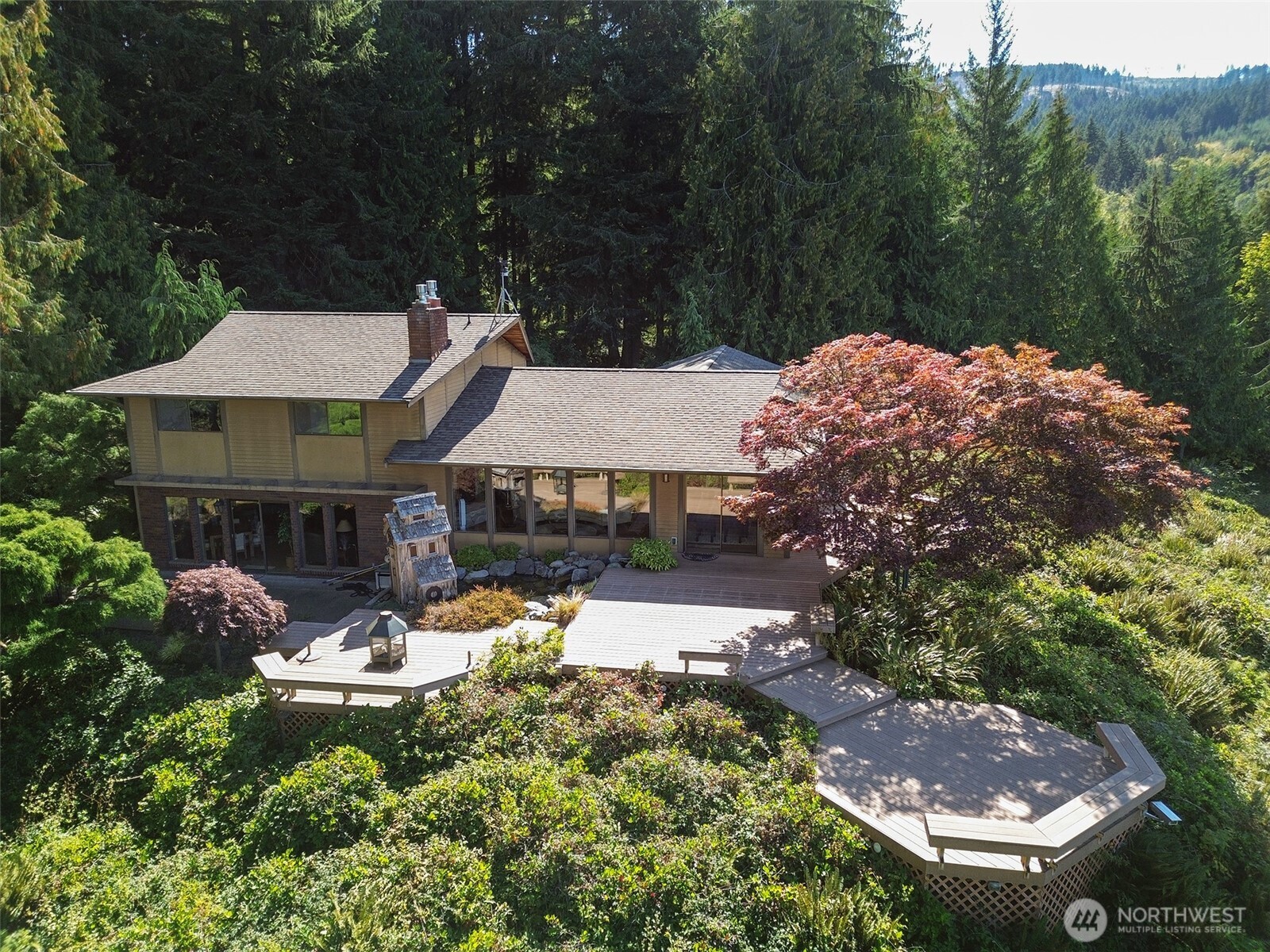 5418 South Old Mill Road Port Angeles, WA 98362 - Photo 2 of 39 an aerial view of a house with garden space and street view