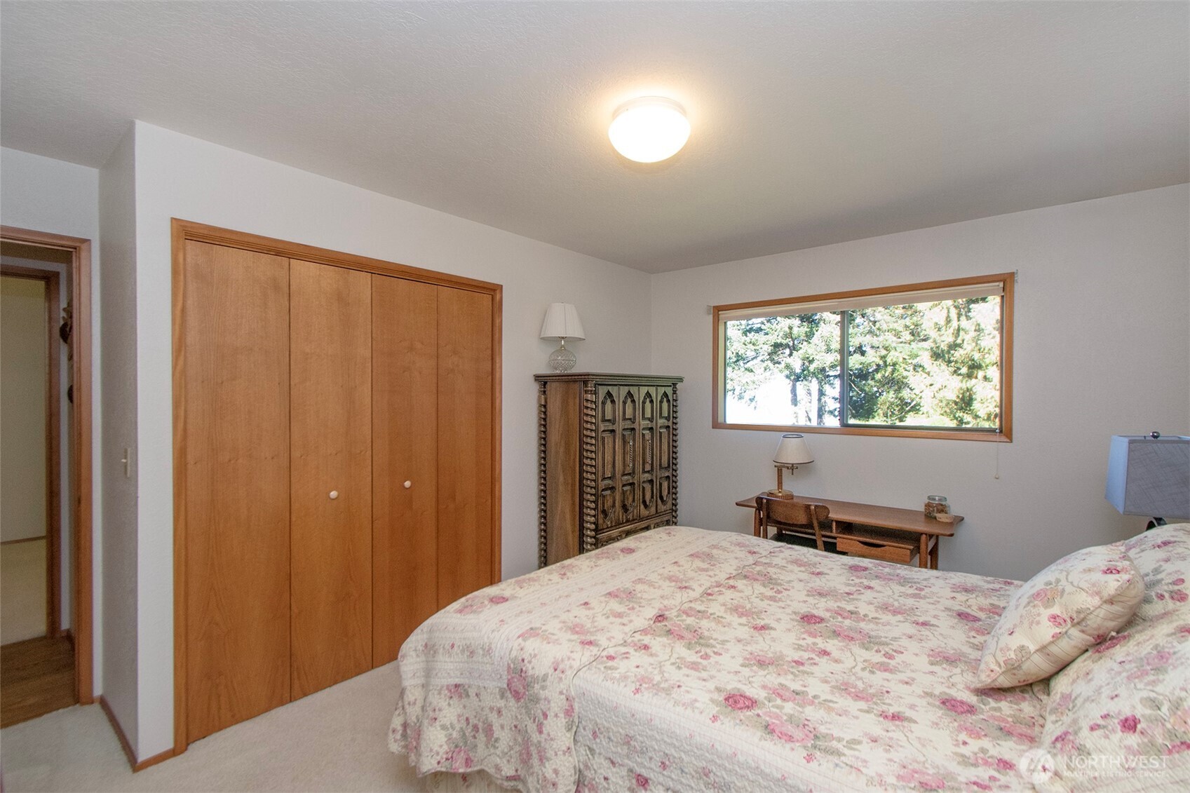 5418 South Old Mill Road Port Angeles, WA 98362 - Photo 22 of 39 a bedroom with a large bed and a window