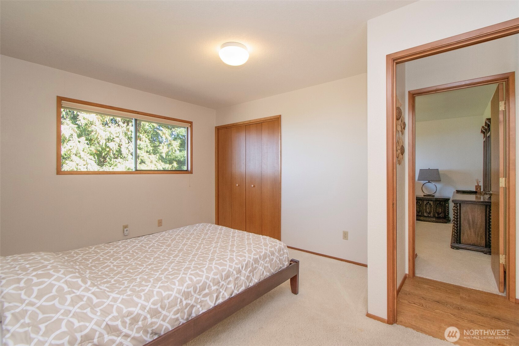 5418 South Old Mill Road Port Angeles, WA 98362 - Photo 23 of 39 a bedroom with a bed and a window