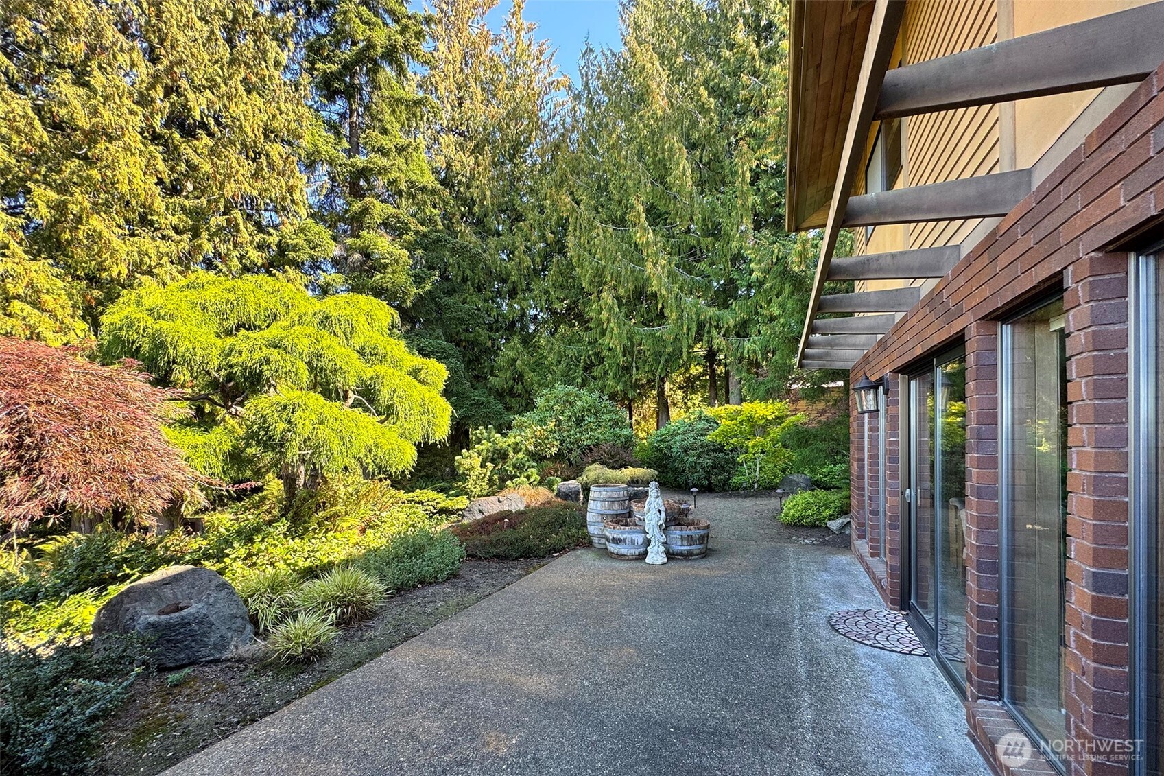 5418 South Old Mill Road Port Angeles, WA 98362 - Photo 28 of 39 a view of a patio with table and chairs and potted plants