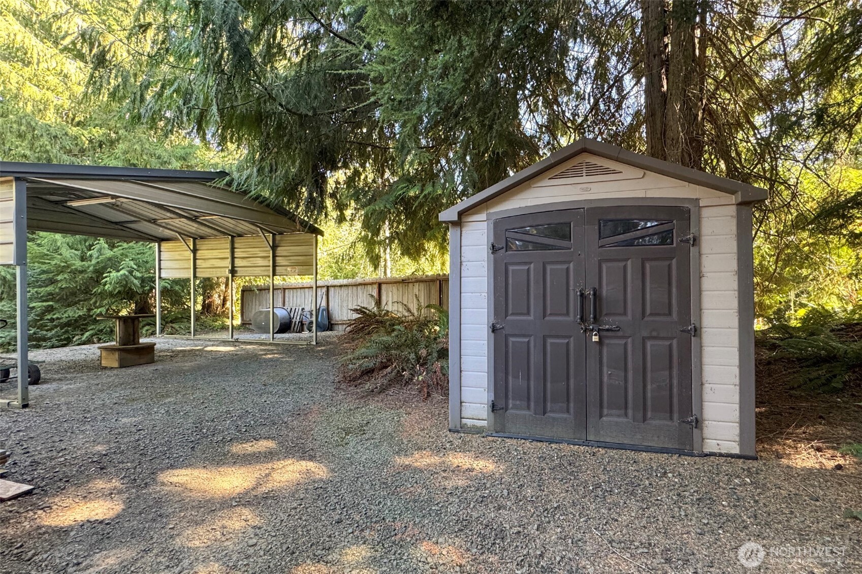 5418 South Old Mill Road Port Angeles, WA 98362 - Photo 34 of 39 a view of a house with a small yard and a large tree