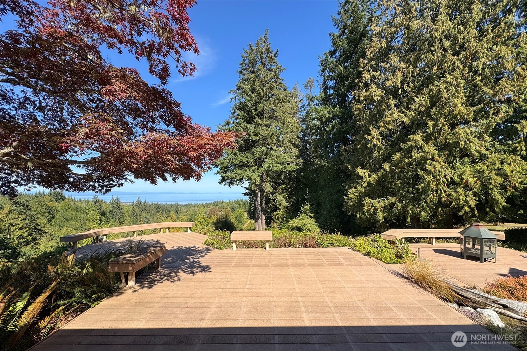 5418 South Old Mill Road Port Angeles, WA 98362 - Photo 5 of 39 a view of a swimming pool with an outdoor space and seating area