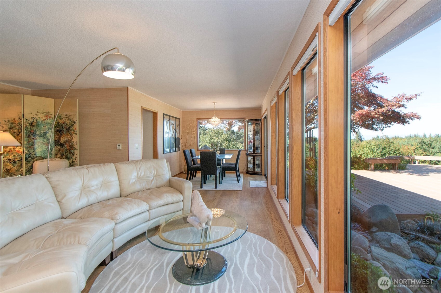 5418 South Old Mill Road Port Angeles, WA 98362 - Photo 9 of 39 a living room with furniture and a floor to ceiling window