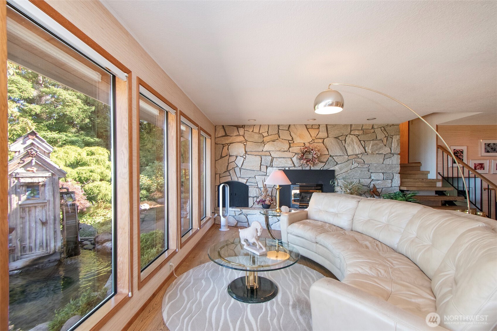5418 South Old Mill Road Port Angeles, WA 98362 - Photo 10 of 39 a living room with fireplace furniture and a large window