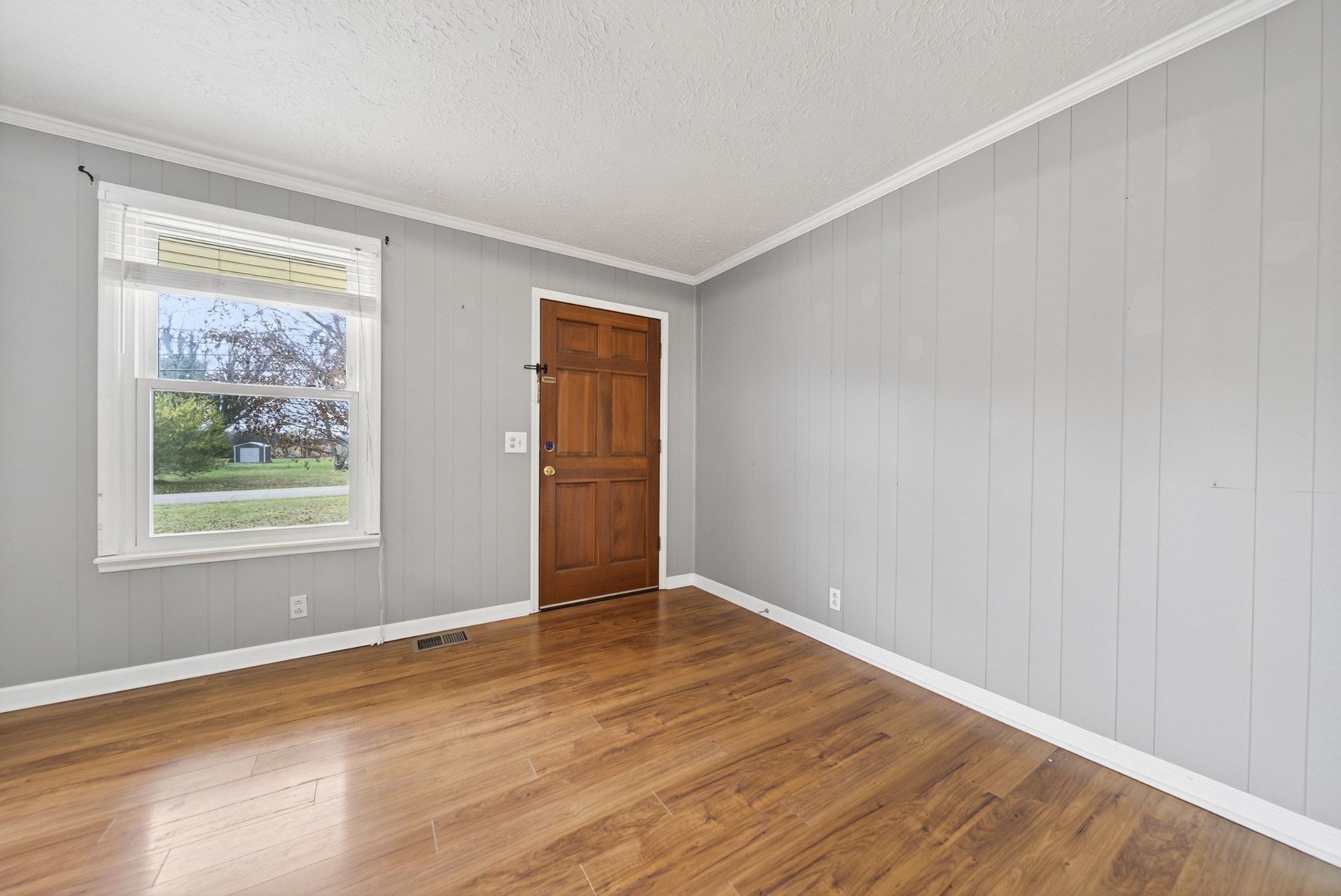 115 Calista Road White House, TN 37188 - Photo 18 of 38 a view of an empty room with wooden floor and a window