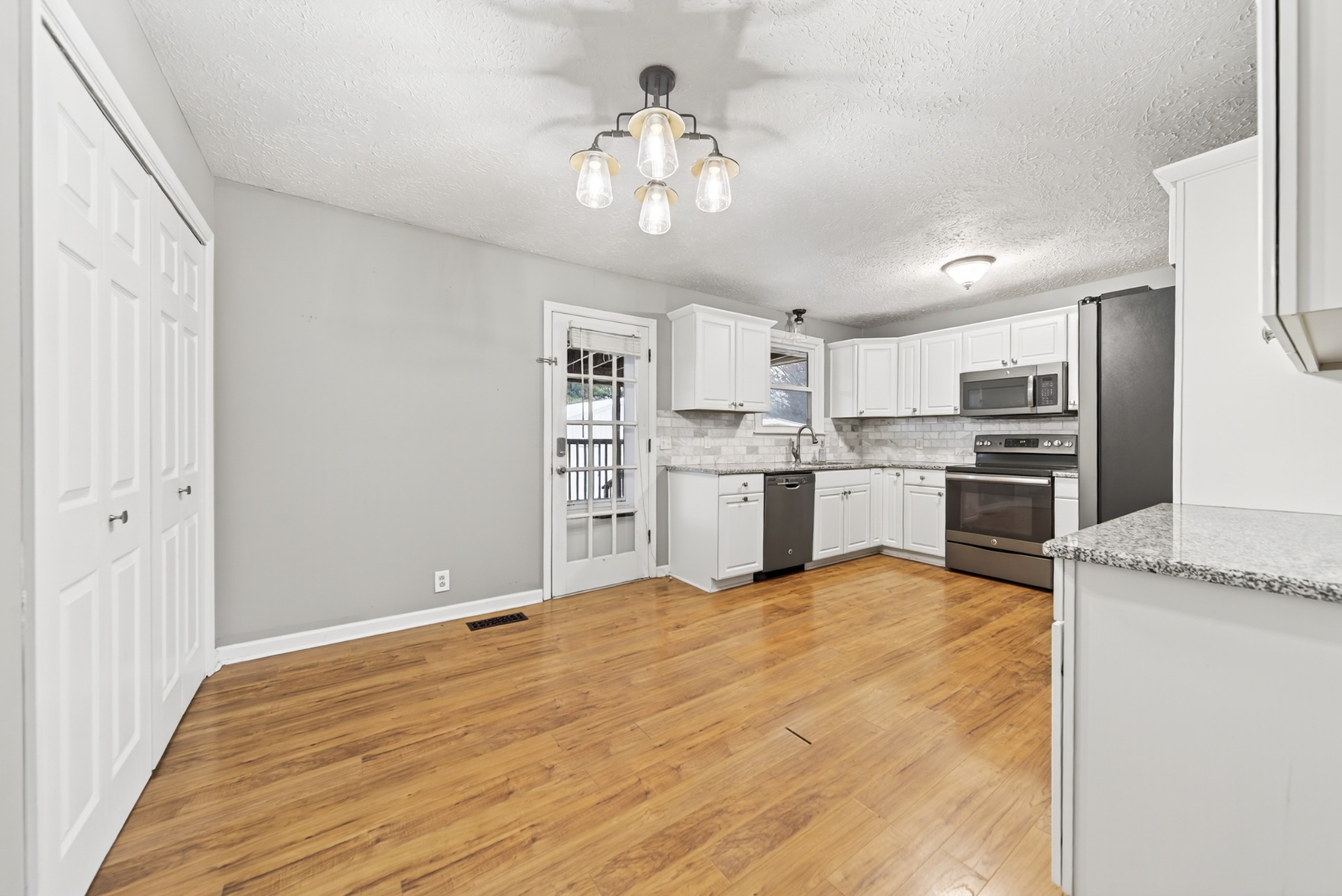 115 Calista Road White House, TN 37188 - Photo 22 of 38 a view of kitchen with granite countertop cabinets and stainless steel appliances