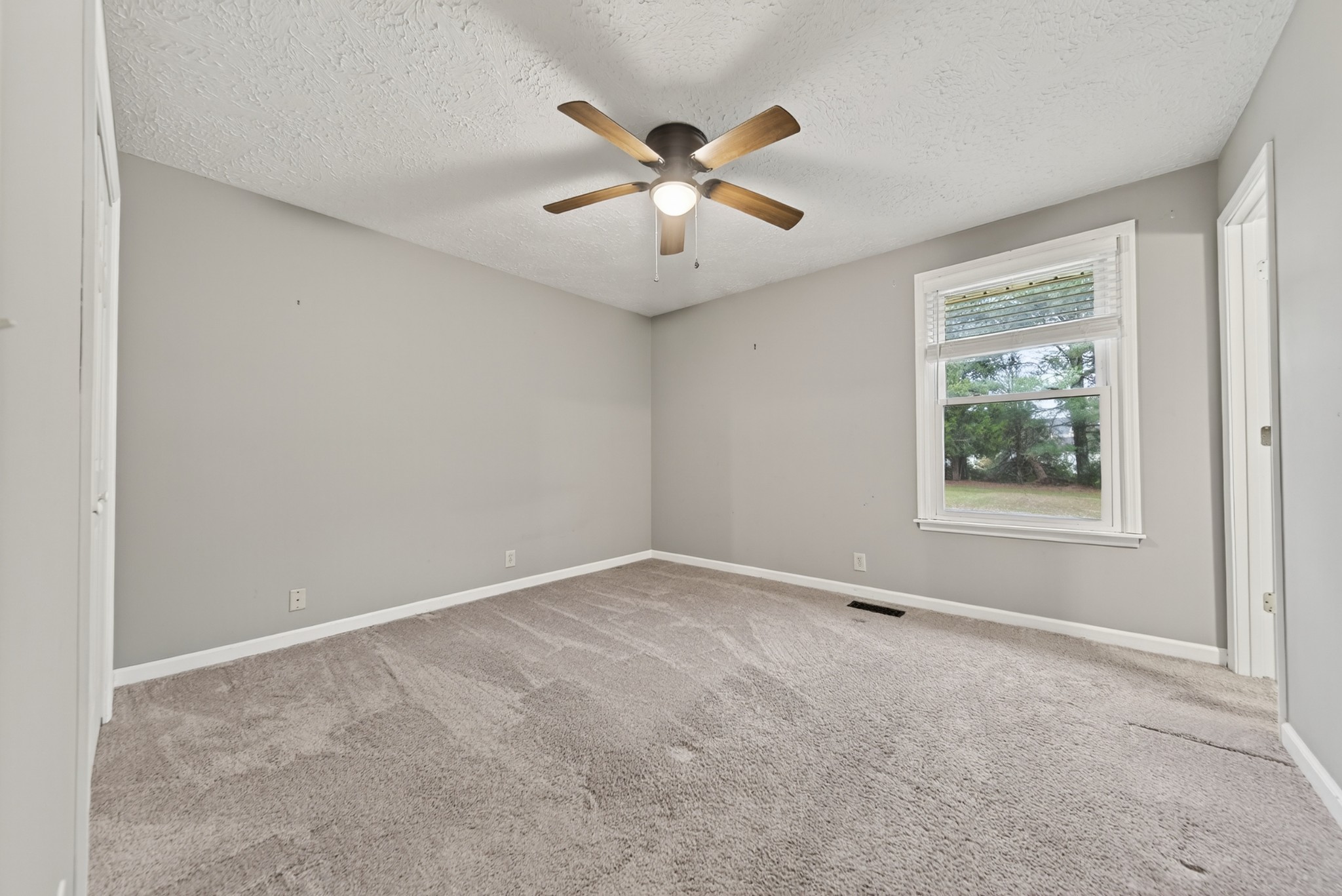 115 Calista Road White House, TN 37188 - Photo 34 of 38 an empty room with ceiling fan and window