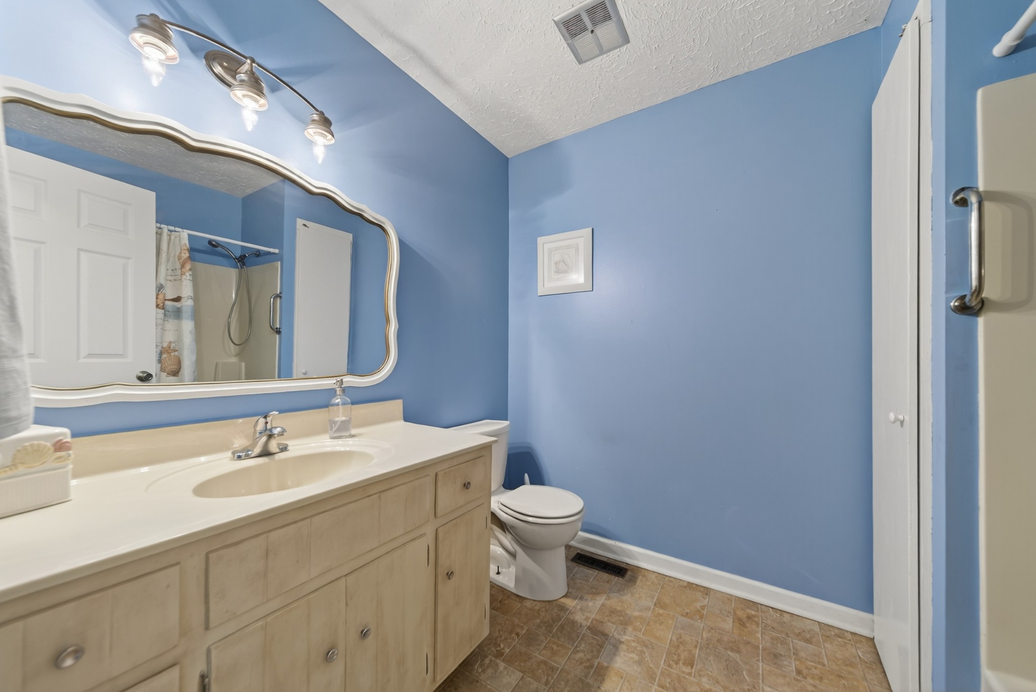 115 Calista Road White House, TN 37188 - Photo 37 of 38 a bathroom with a sink a toilet and a mirror