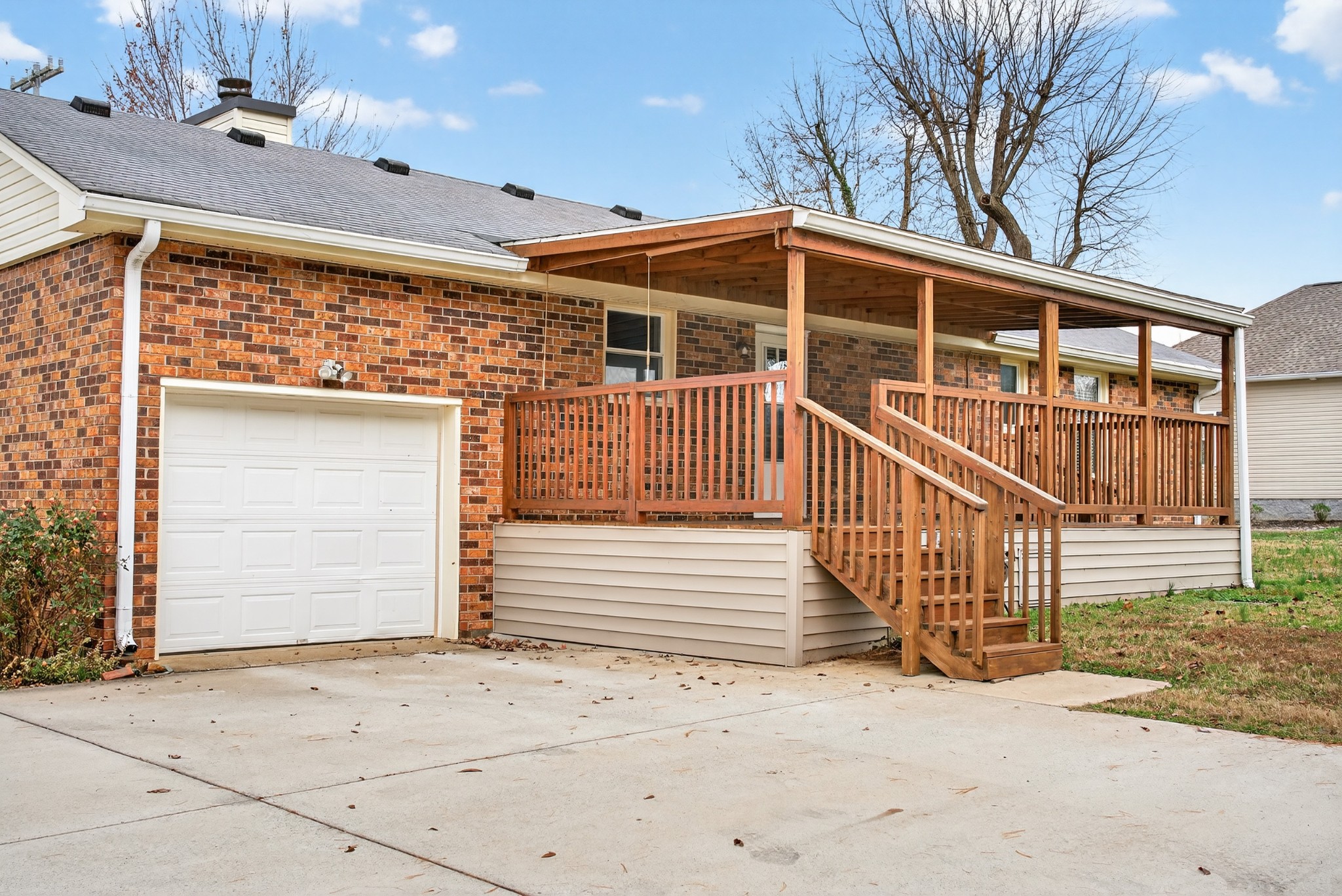 115 Calista Road White House, TN 37188 - Photo 10 of 38 a view of a house with a wooden bench