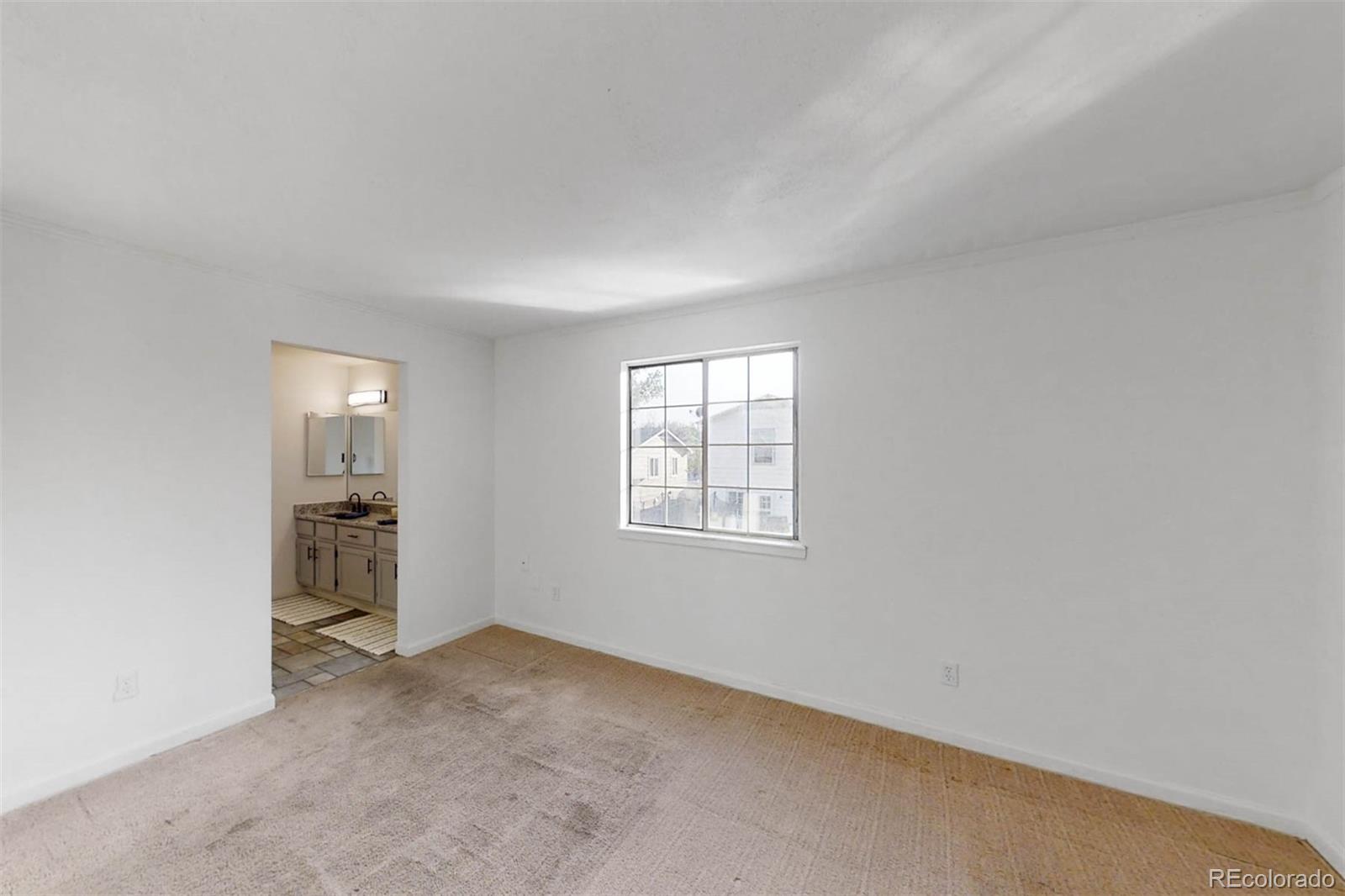 6283 Xavier Street Arvada, CO 80003 - Photo 16 of 36 an empty room with windows and closet