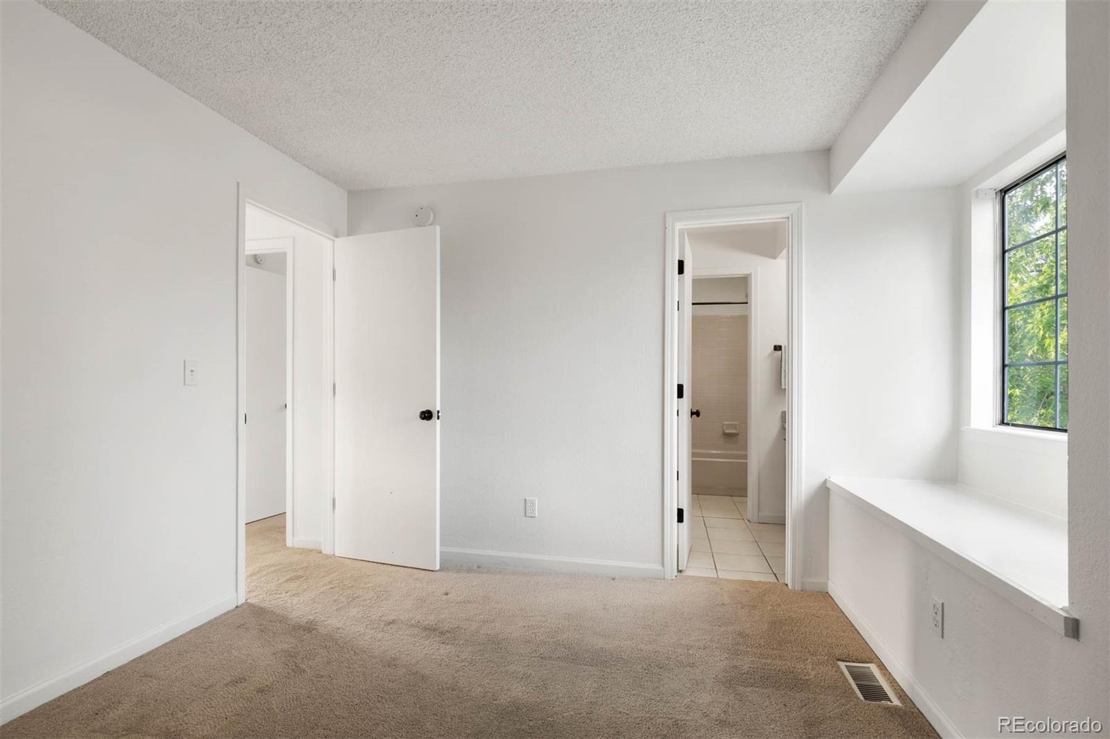 6283 Xavier Street Arvada, CO 80003 - Photo 22 of 36 a view of an empty room and window