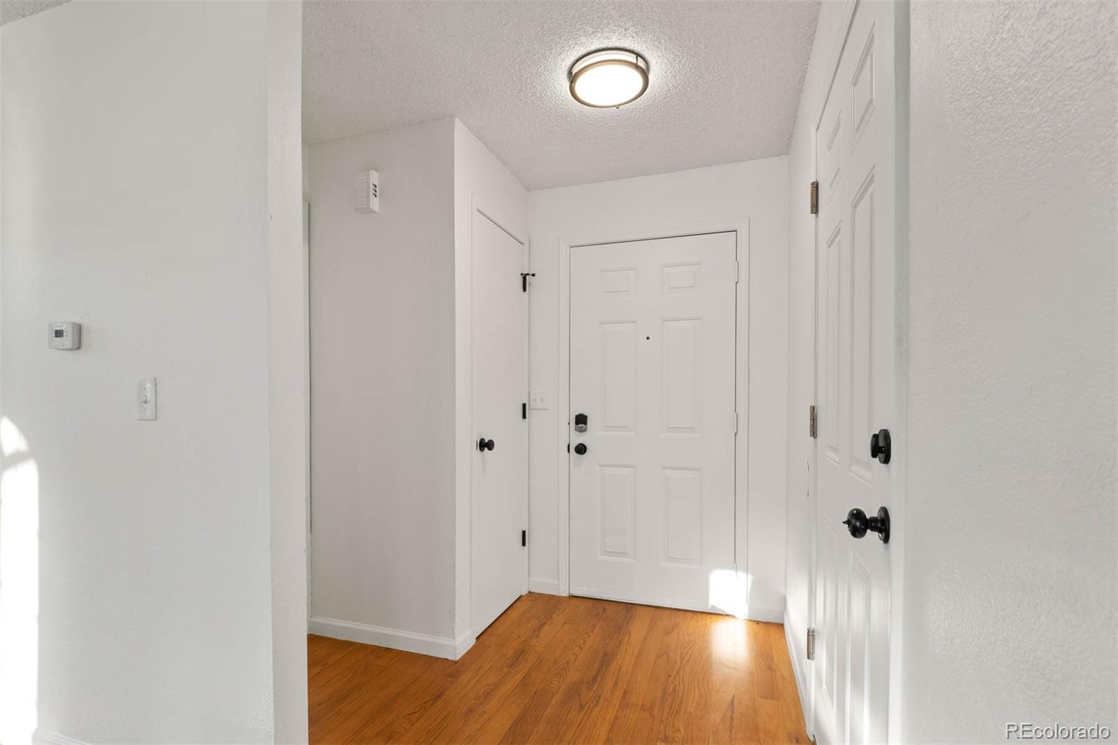 6283 Xavier Street Arvada, CO 80003 - Photo 4 of 36 a view of room with wooden floor